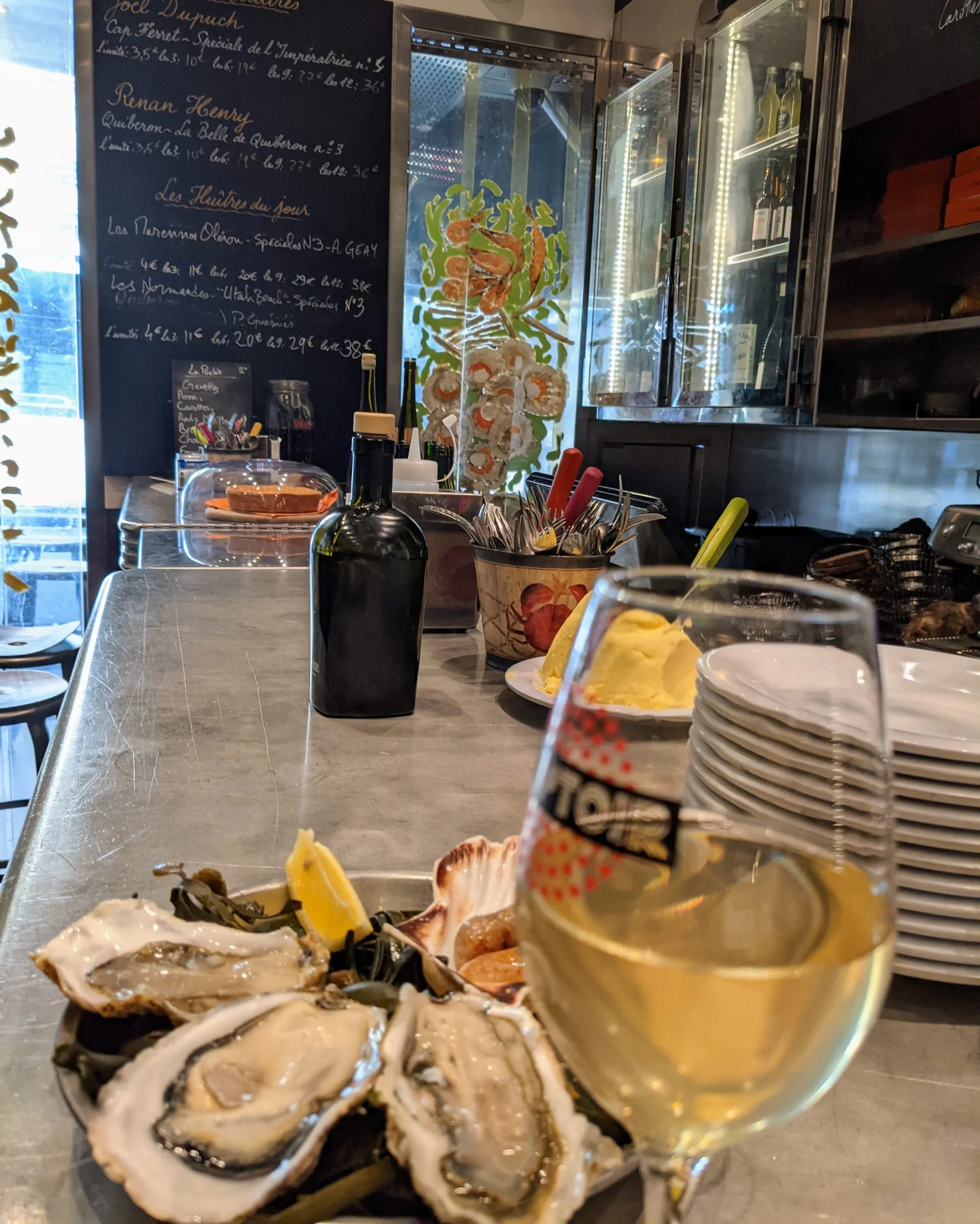 Wine, oysters and butter at a Paris wine bar during a chef-led Paris food tour with Eat Like The French