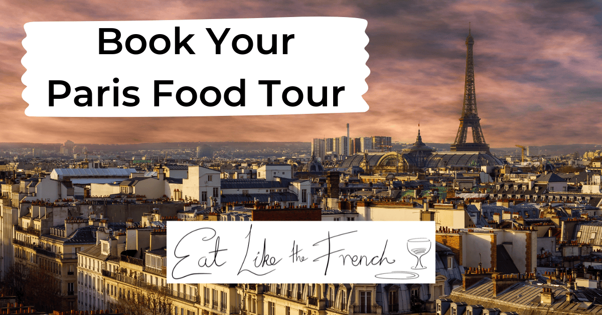 a skyline of paris with the text book a food tour in paris