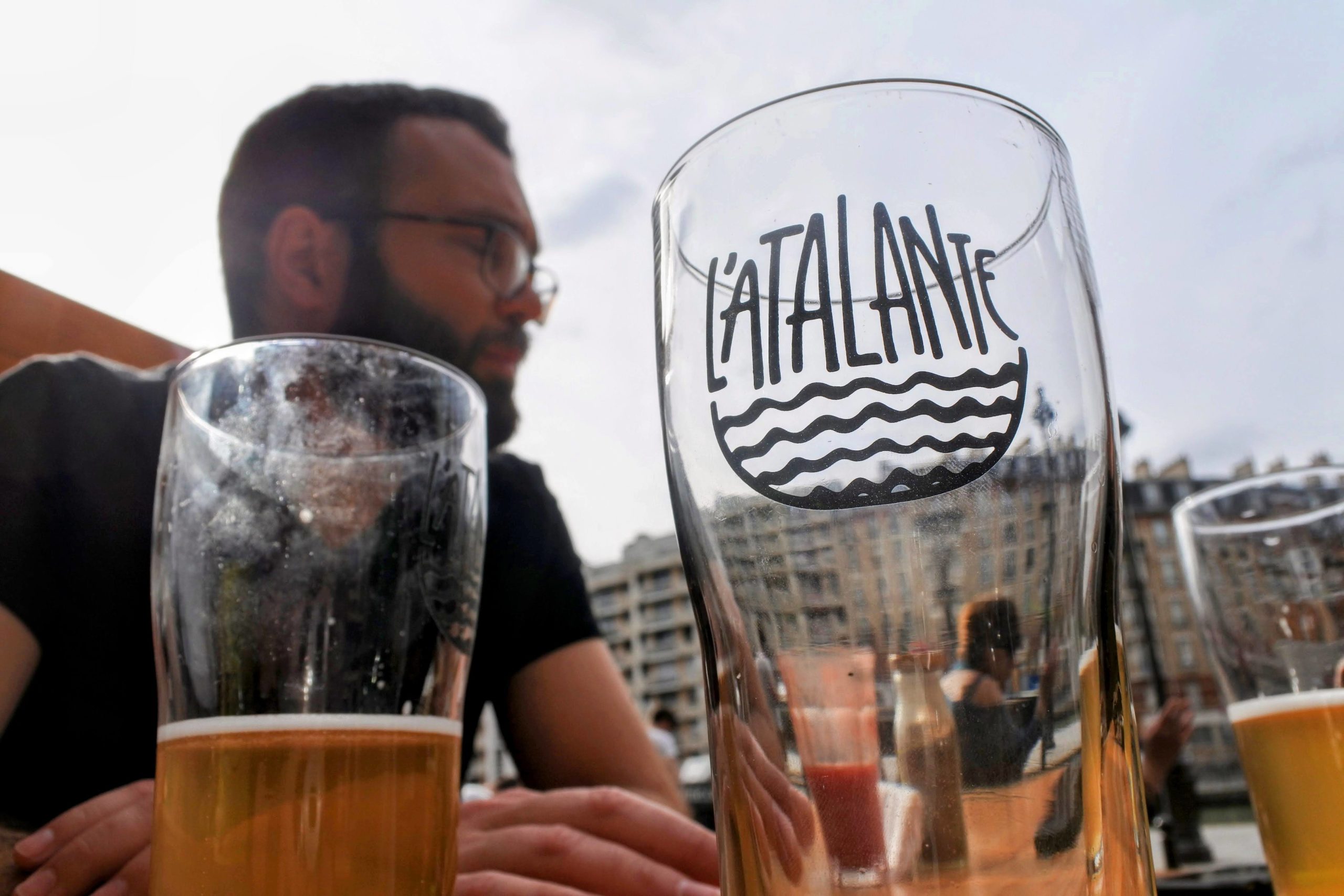 a picture of a friend of mine drinking craft beer in paris at the atalante