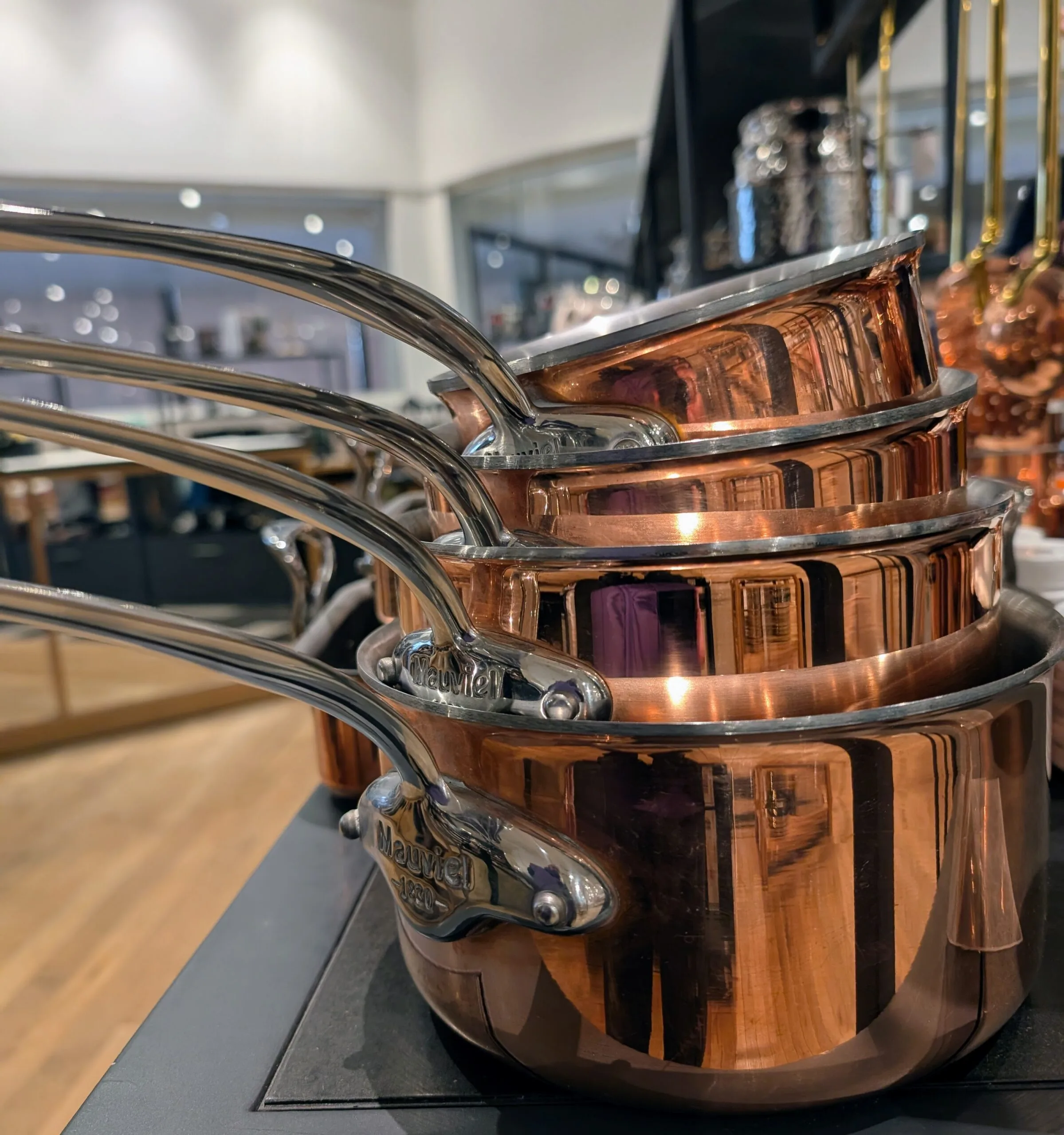 a picture taken of copper pans on a foodie souvenir shopping trip in Paris