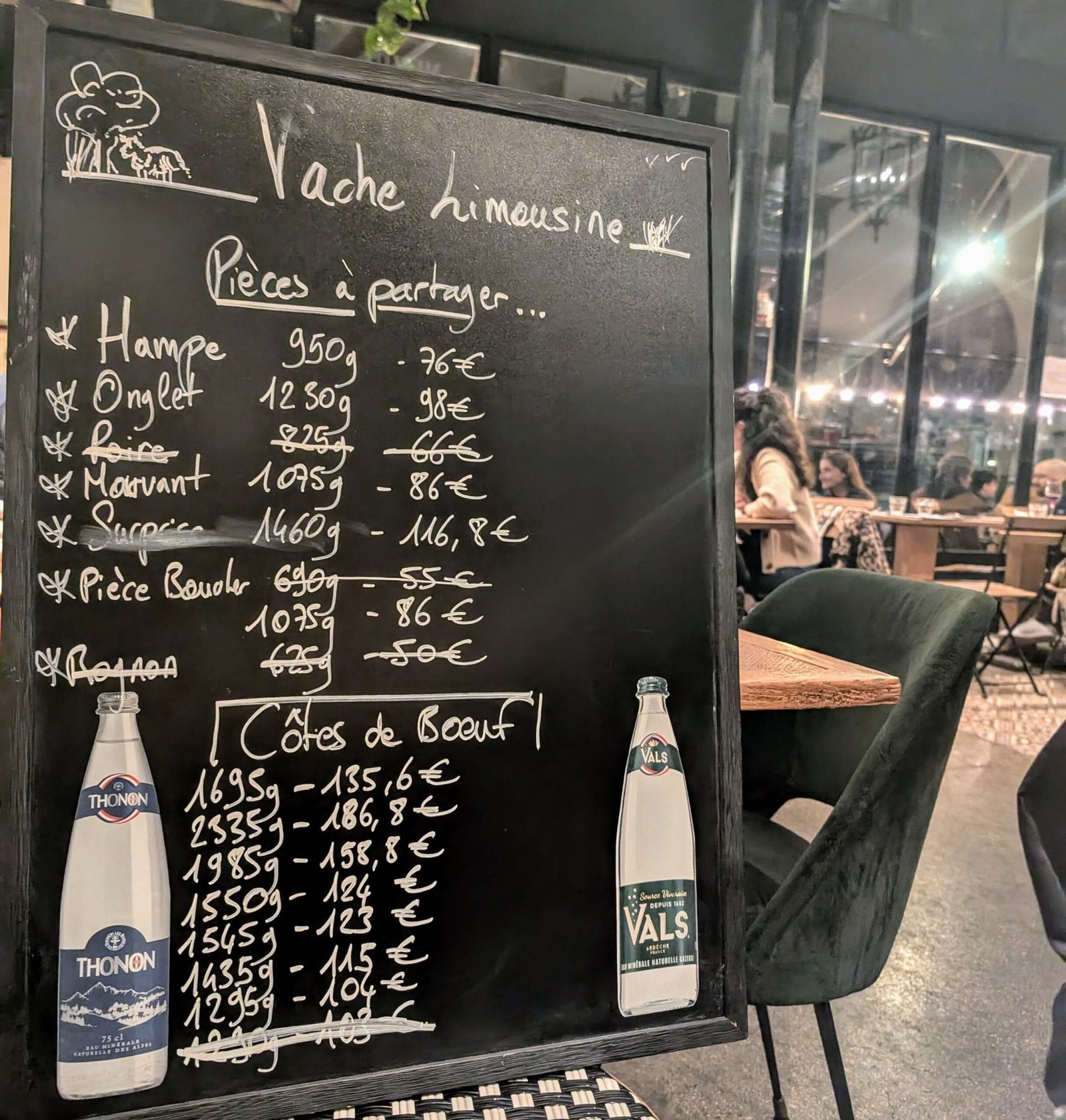 Les Foudres - Steak Frites Menu Chalkboard steak menu at Les Foudres Paris showing Limousin beef cuts and prices, including onglet, hampe, and côte de boeuf for sharing.