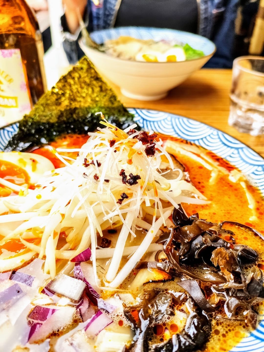 Spicy ramen bowl with egg, mushrooms and toppings at Kiwamiya Ramen in Boulogne-Billancourt