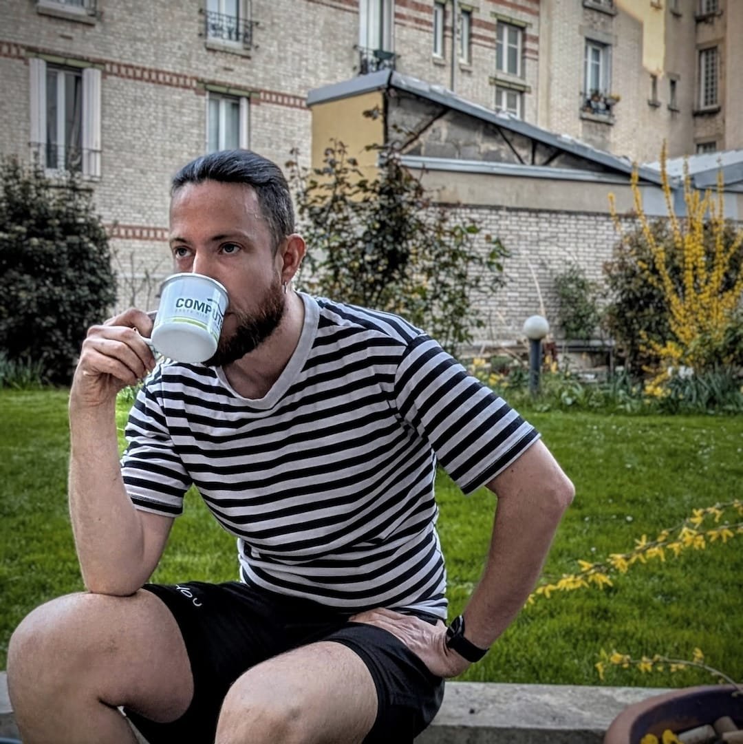 Chef drinking coffee in a Parisian garden courtyard in Boulogne-Billancourt